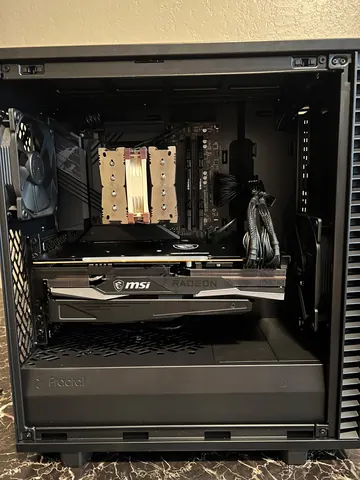 The finished build: the same parts assembled in a Fractal case with a tower air cooler and MSI Radeon graphics card
